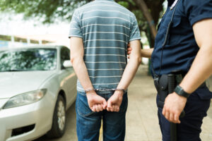 White male in handcuffs after getting arrested